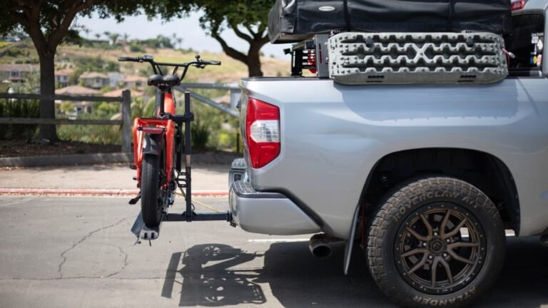 Securely installed 2 bike hitch rack holding two bicycles on the back of an SUV, ready for an outdoor adventure